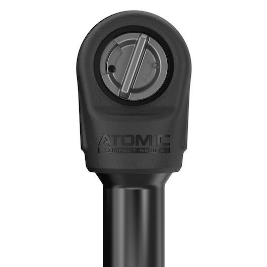 Close-up view of a DEWALT Atomic Compact Series ratchet head, showing the directional switch and branding.